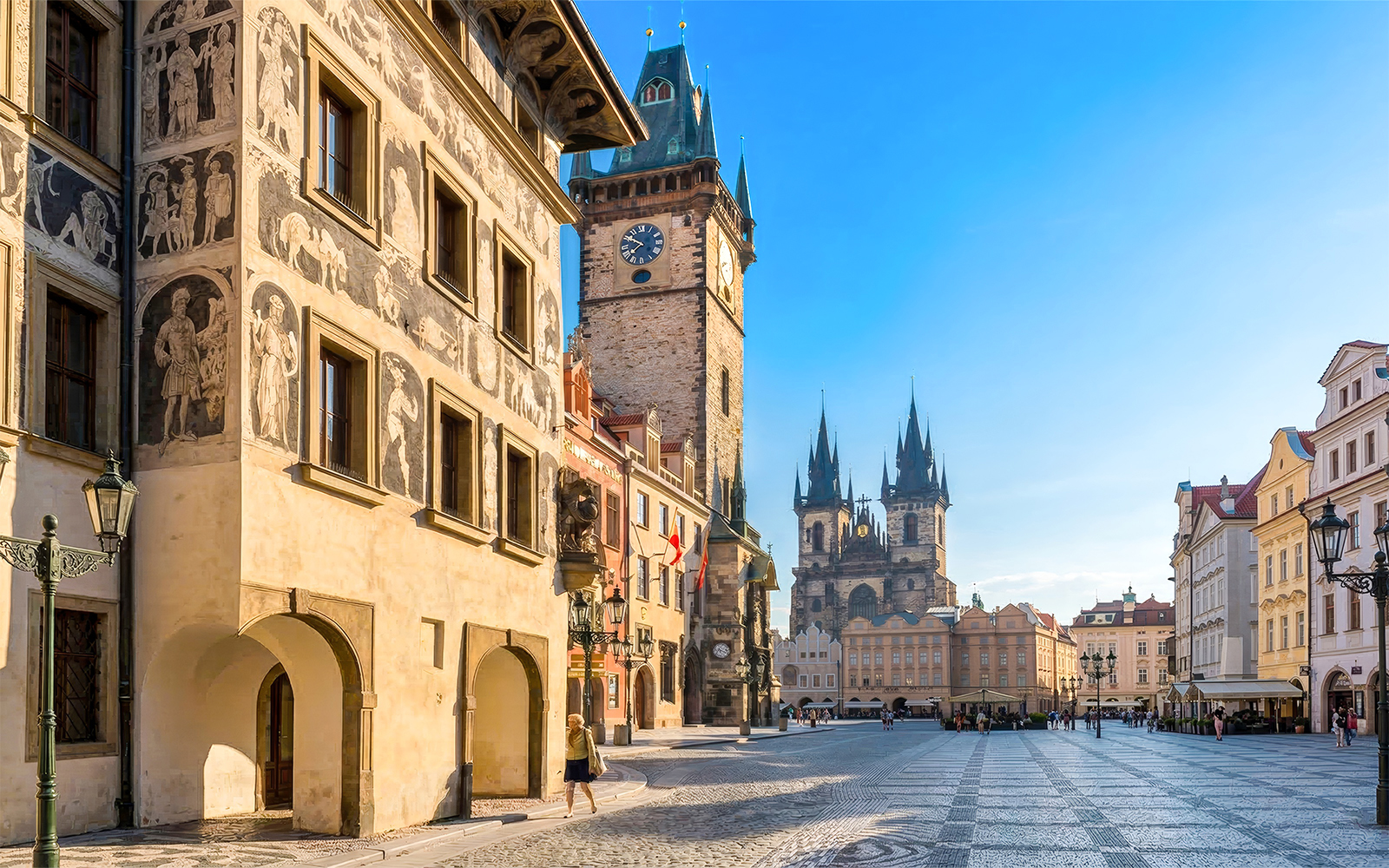 Prague Old Town Square with historic buildings and Tyn Church in the background.