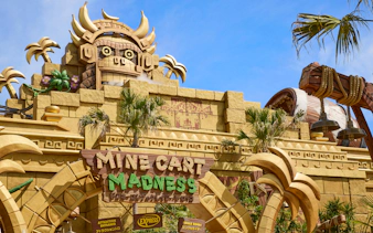 Universal Studios Japan Mine Cart Madness entrance with themed architecture.