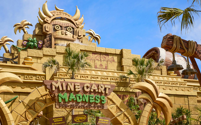 Universal Studios Japan Mine Cart Madness entrance with themed architecture.