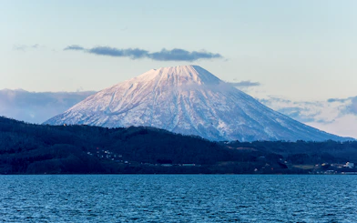 Snow-capped Mount Yotei viewed from Lake Toya, Japan.