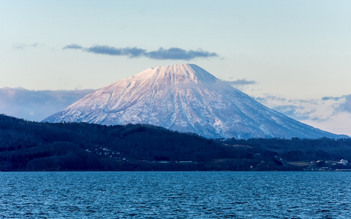 Snow-capped Mount Yotei viewed from Lake Toya, Japan.