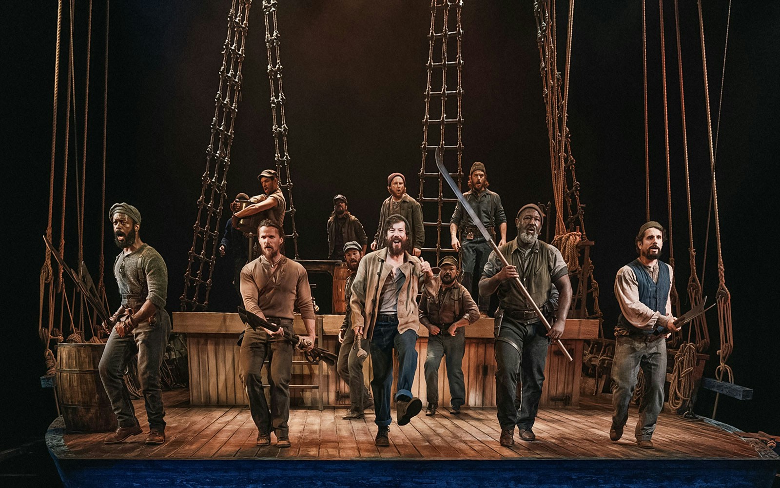 Actors performing a nautical scene on stage with ship rigging, related to "Swept Away.