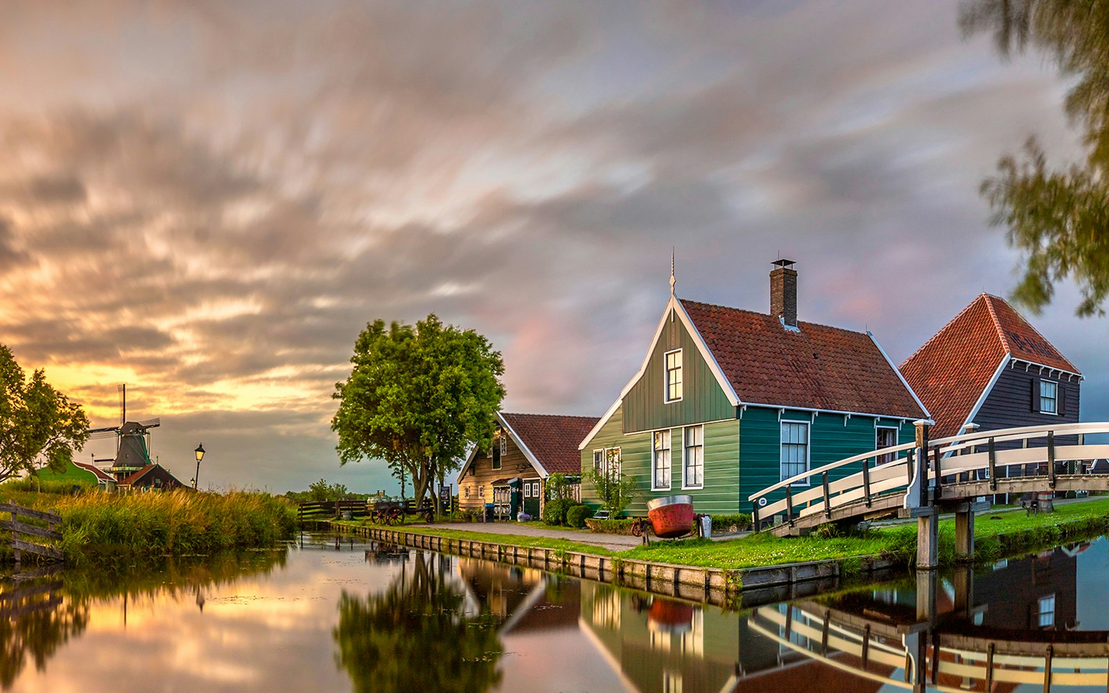 Traditional wooden house by canal, Zaanse Schans, Zaandam, Netherlands.