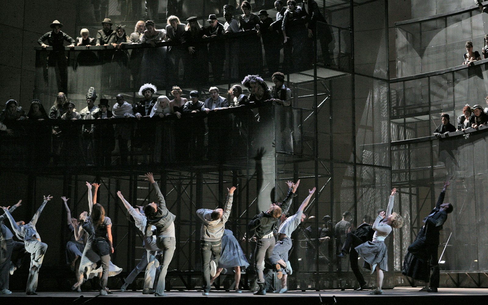 Performers on stage during Orfeo ed Euridice opera with audience in background.
