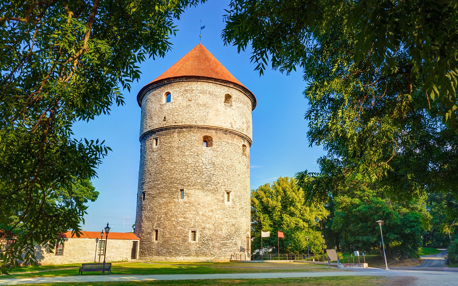 Tallinn's medieval tower in Towers Park surrounded by trees.