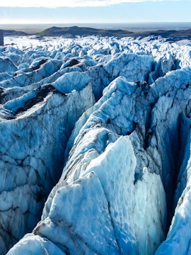 Vatnajokull glacier's icy crevasses and rugged terrain in Iceland.