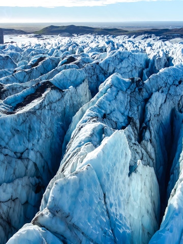 Vatnajokull glacier's icy crevasses and rugged terrain in Iceland.