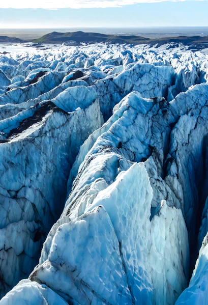 Vatnajokull glacier's icy crevasses and rugged terrain in Iceland.