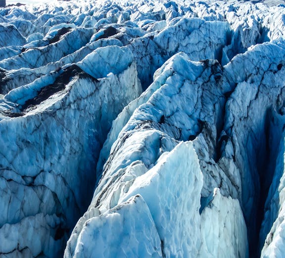 Vatnajokull glacier's icy crevasses and rugged terrain in Iceland.