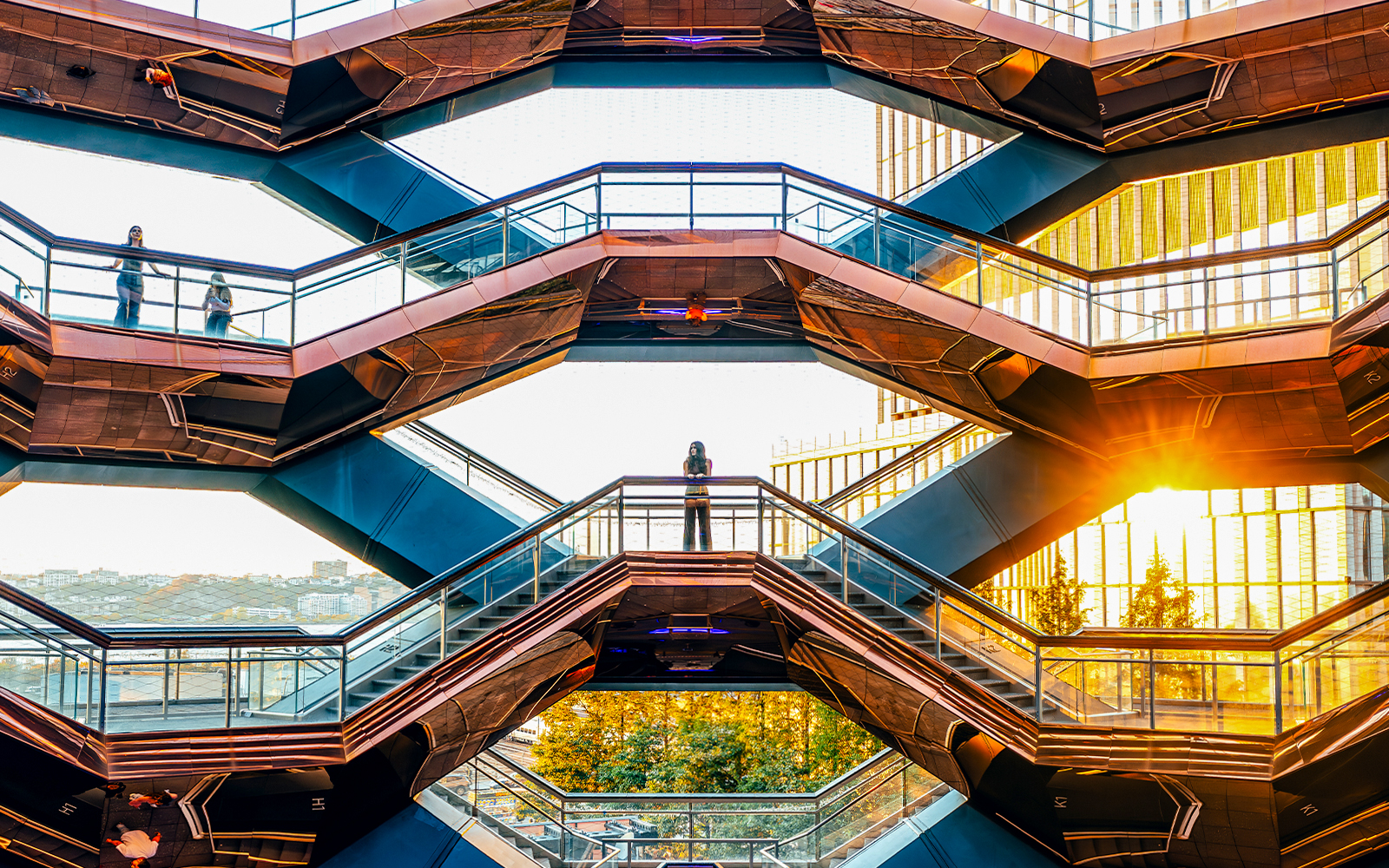 Vessel structure in New York City with visitors exploring the honeycomb design.