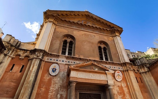 Basilica of Santa Pudenziana facade in Rome, featuring ornate architectural details.