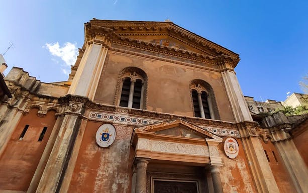Basilica of Santa Pudenziana facade in Rome, featuring ornate architectural details.