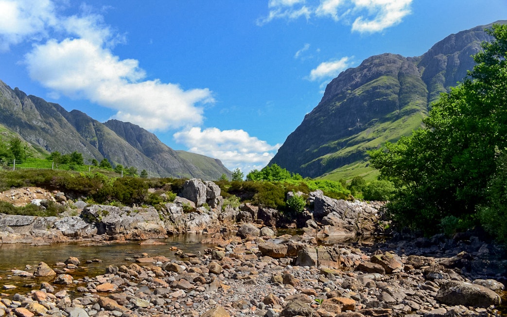 Glenfinnan and Glencoe mountains with rocky stream, part of Fort William tour from Edinburgh.