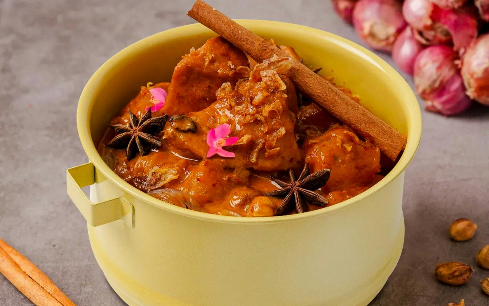 Thai curry dish with star anise and cinnamon in a yellow bowl, Andamanda Phuket Water Park.