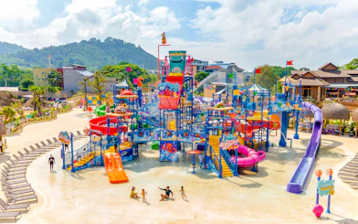 Andamanda Phuket water park with colorful slides and play structures.