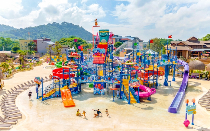 Andamanda Phuket water park with colorful slides and play structures.