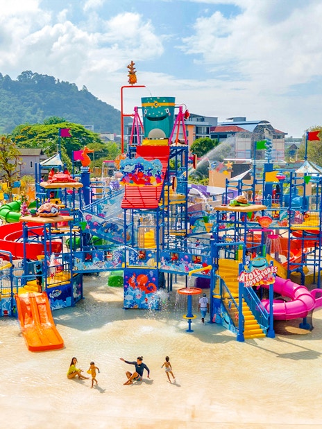 Andamanda Phuket water park with colorful slides and play structures.