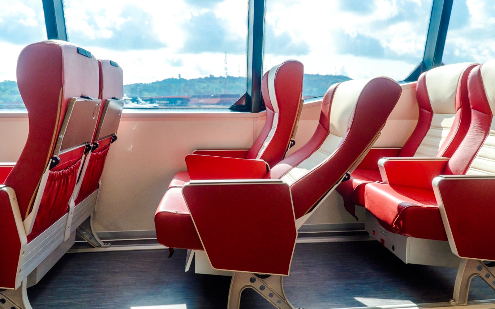 Ferry seats with red upholstery on the Singapore to Bintan route.