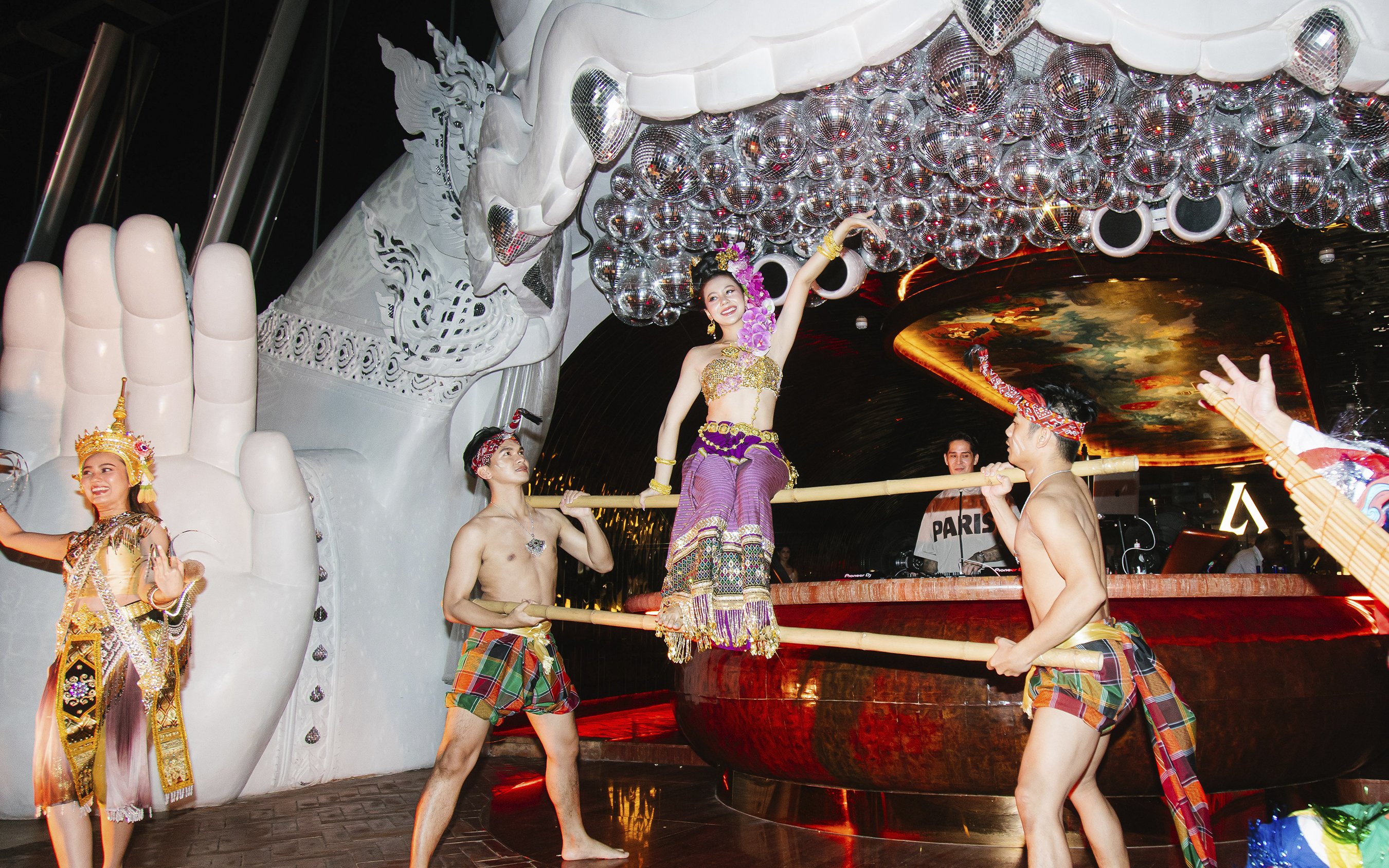 Thai traditional dance performance at Akara Sky with dancers in vibrant costumes.