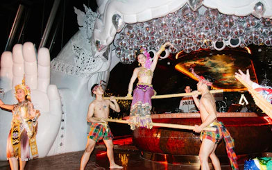 Thai traditional dance performance at Akara Sky with dancers in vibrant costumes.