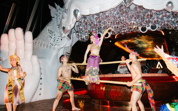 Thai traditional dance performance at Akara Sky with dancers in vibrant costumes.