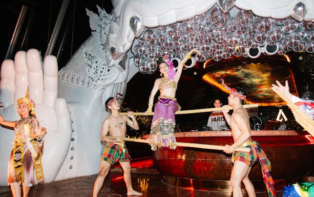 Thai traditional dance performance at Akara Sky with dancers in vibrant costumes.