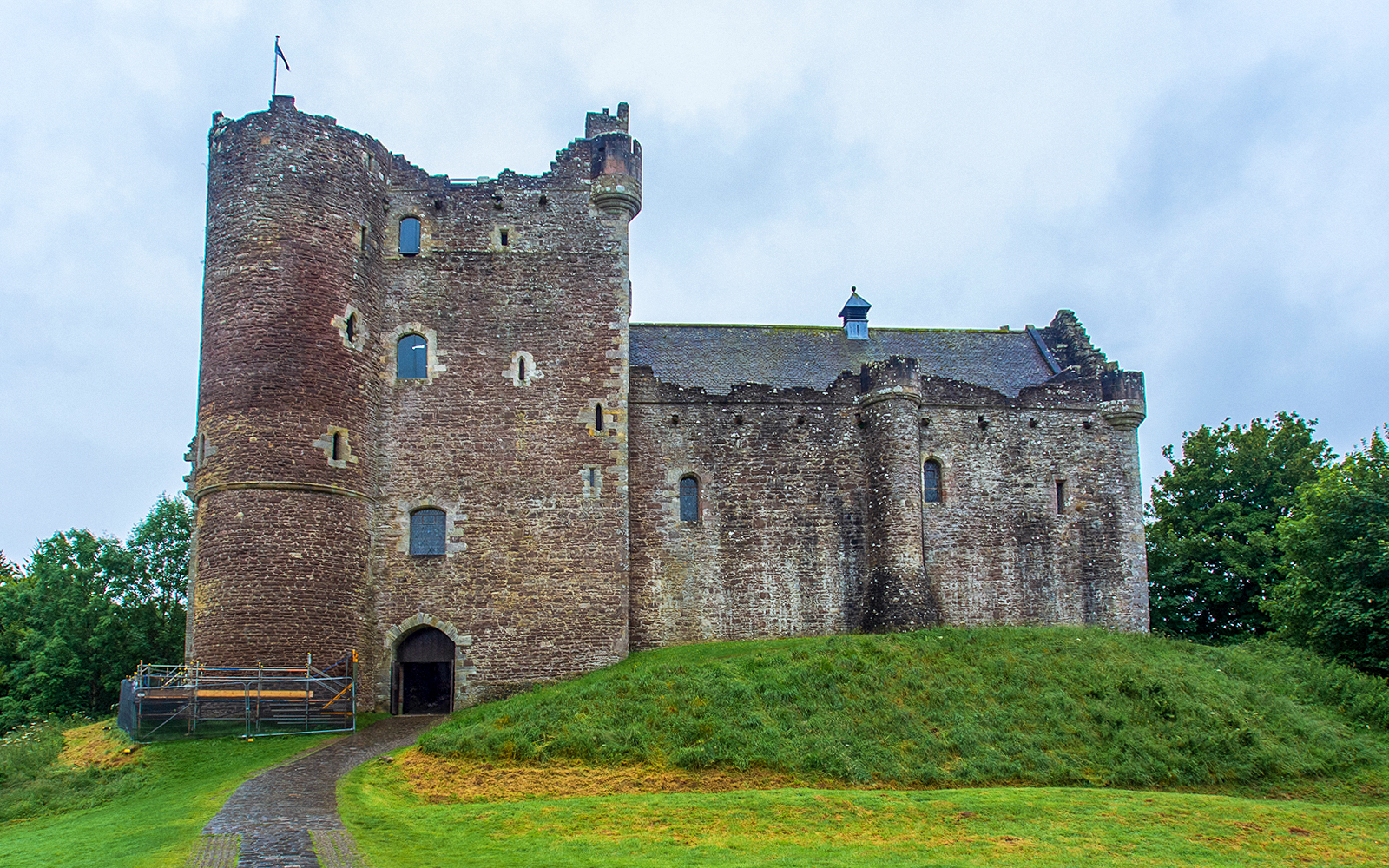 Stirling Castle in Scotland with stone walls and green landscape.