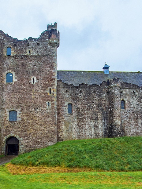 Stirling Castle in Scotland with stone walls and green landscape.