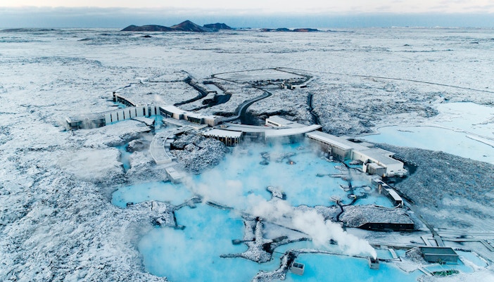 Aerial view of Blue Lagoon geothermal spa in Iceland with turquoise waters and surrounding lava fields