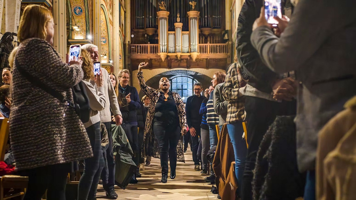 Orchestra performance at St Germain des Prés Church, Paris, with audience in attendance.