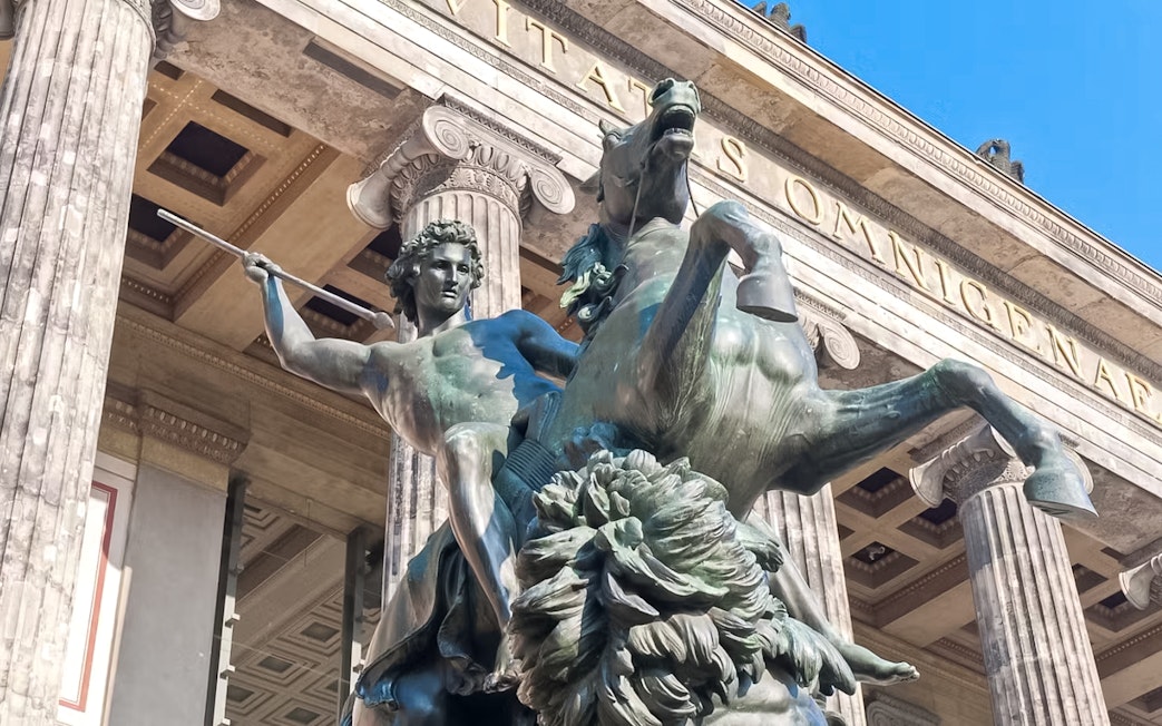 Statue of a warrior on horseback at Altes Museum entrance, Berlin.