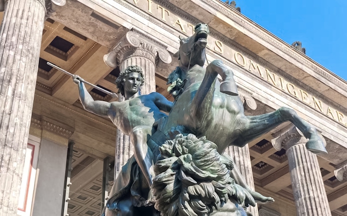 Statue of a warrior on horseback at Altes Museum entrance, Berlin.