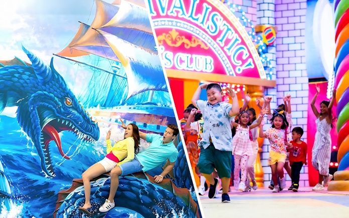 Couple posing with sea dragon mural at Aquaria Phuket.