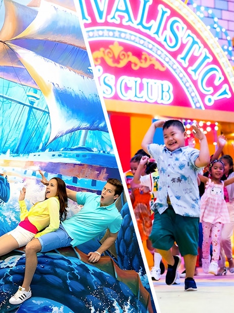 Couple posing with sea dragon mural at Aquaria Phuket.