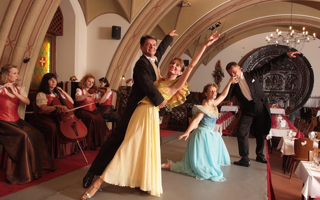 Dancers and musicians performing at an Austrian Dinner Show in Vienna.