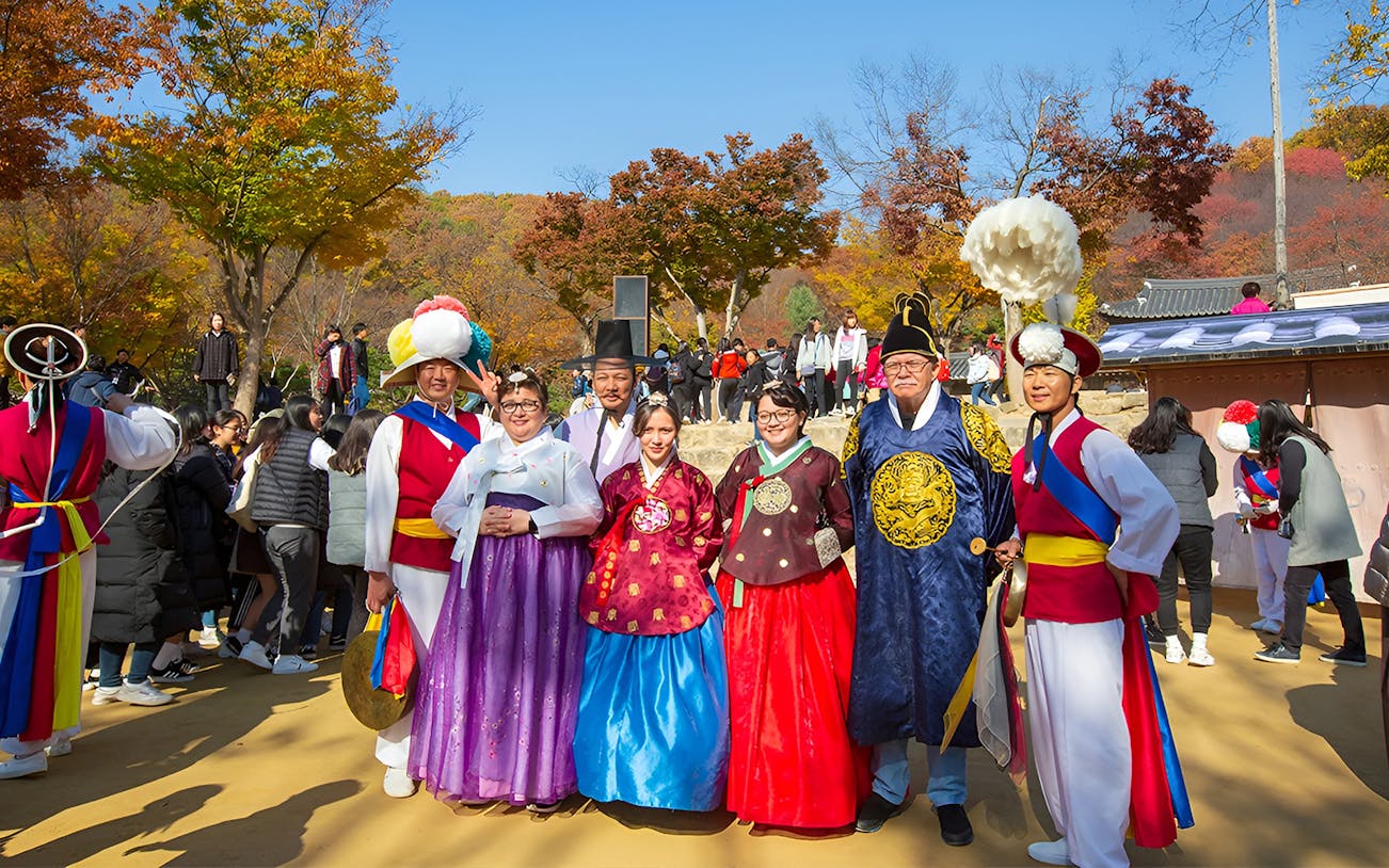 Visitors in traditional Korean attire at Korean Folk Village near Seoul.