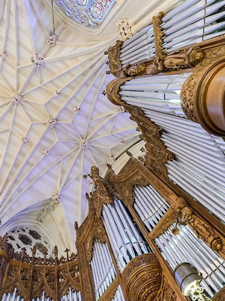 St. Patrick's Cathedral organ pipes and ornate ceiling detail, New York City.
