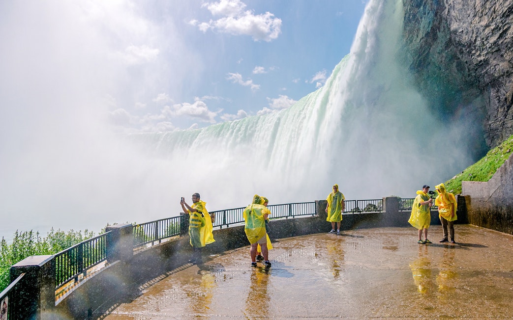 Visitors in yellow ponchos at Journey Behind the Falls, Niagara Falls.