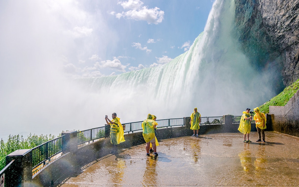 Visitors in yellow ponchos at Journey Behind the Falls, Niagara Falls.