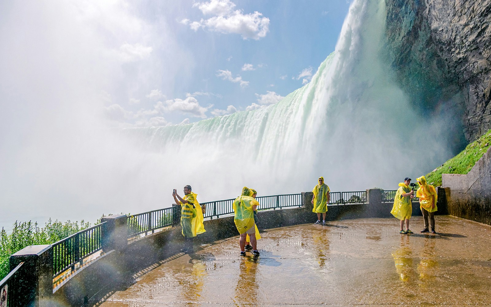 Visitors in yellow ponchos at Journey Behind the Falls, Niagara Falls.