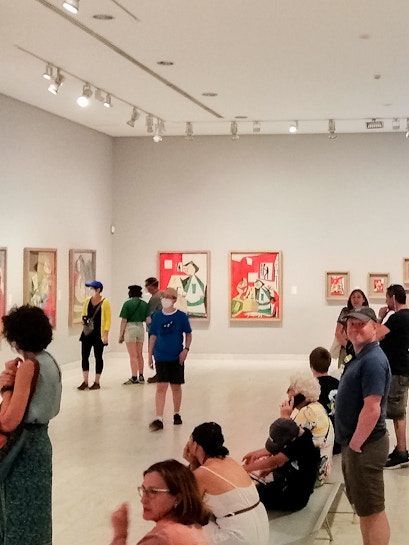 Visitors viewing artwork inside Picasso Museum, Barcelona.