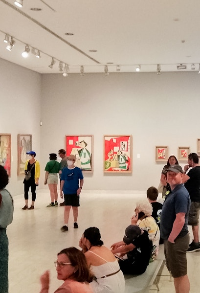 Visitors viewing artwork inside Picasso Museum, Barcelona.