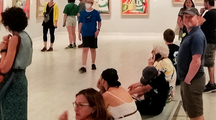 Visitors viewing artwork inside Picasso Museum, Barcelona.