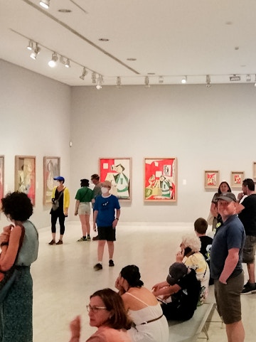 Visitors viewing artwork inside Picasso Museum, Barcelona.