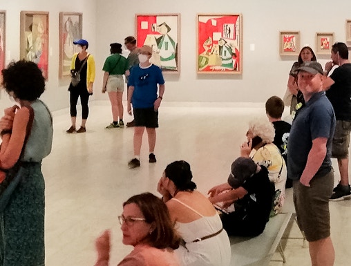 Visitors viewing artwork inside Picasso Museum, Barcelona.