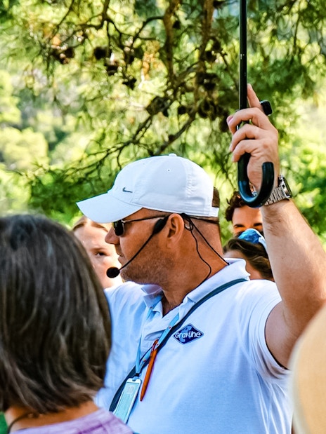 Tour guide giving directions to a group at Krka National Park.