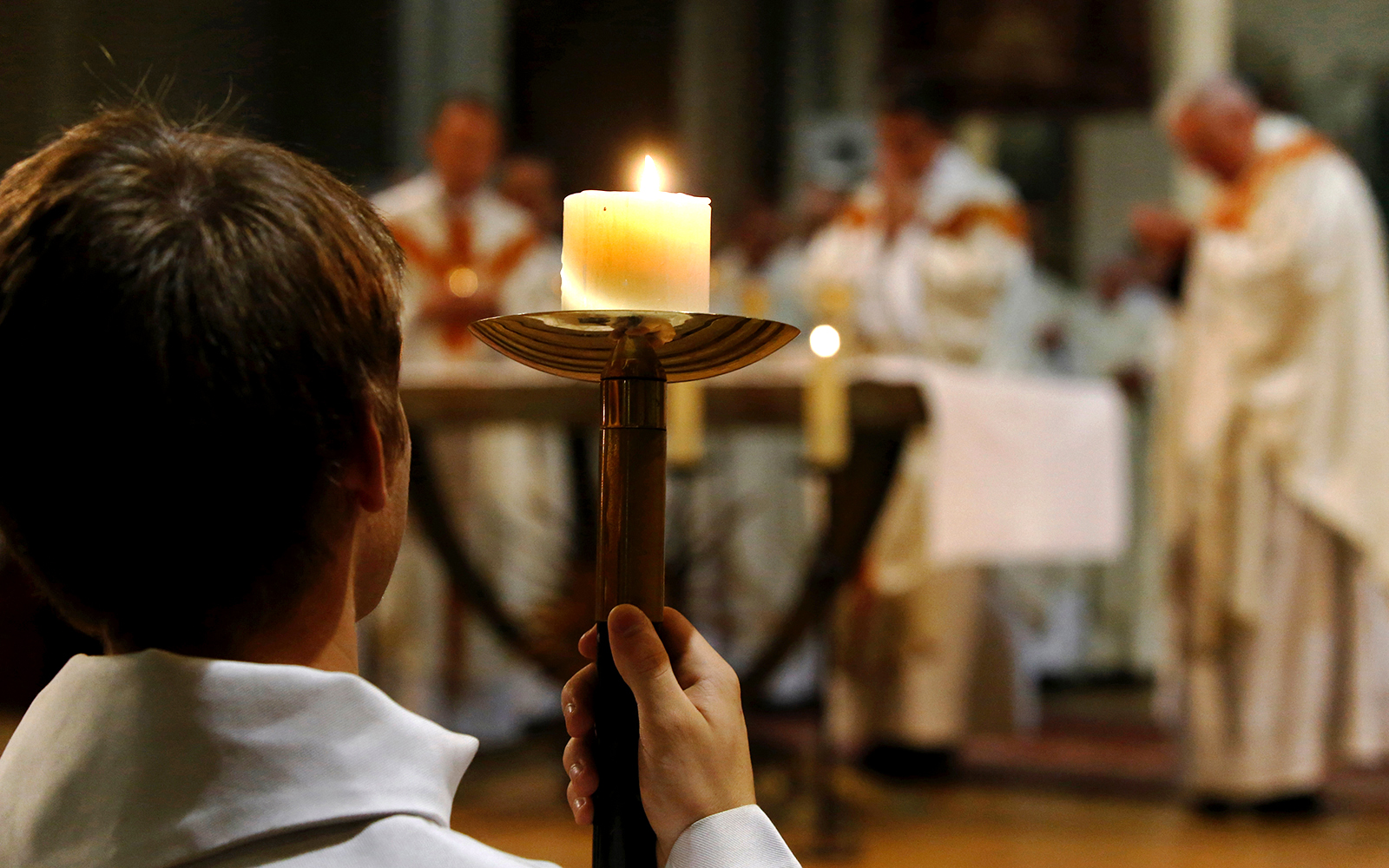 Notre Dame Cathedral interior during mass, Paris, France.