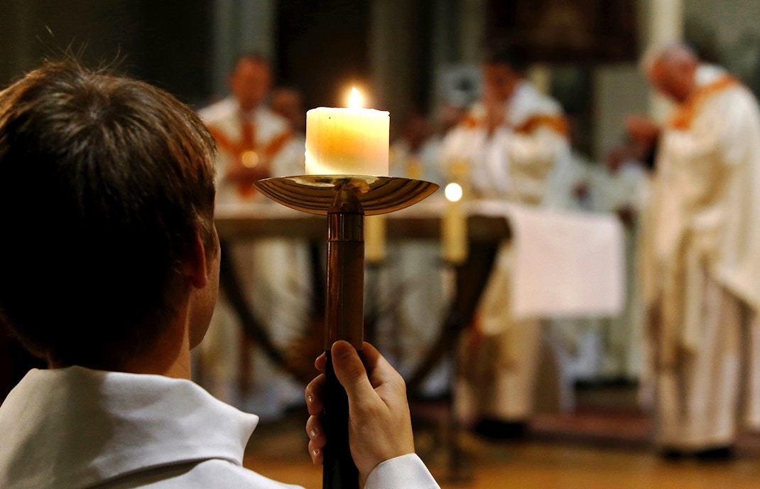 Candle held during mass