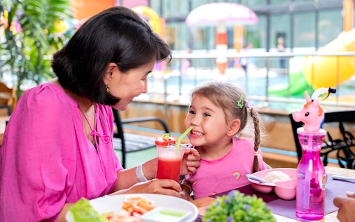 Mother and child enjoying drinks at Rawai Kids Park.
