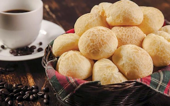 Basket of pão de queijo with coffee cup, Coffee Valley, Rio de Janeiro tour.